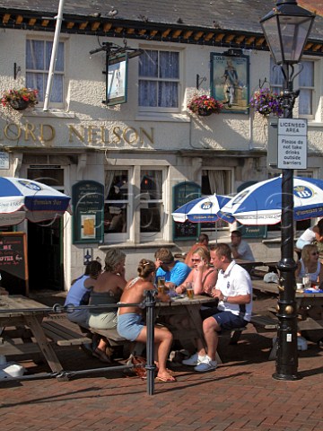 People drinking outside the Jolly Sailor public   house Poole Dorset England