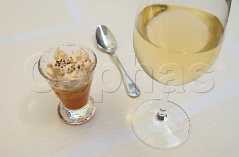 Amuse bouche of tomato jus and prawn mousseline with  glass of Chablis wine