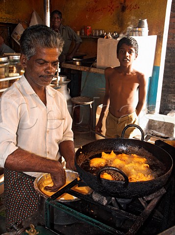 Indian man cooking egg bhaji Deepfried boiled   egg Chennai Madras India