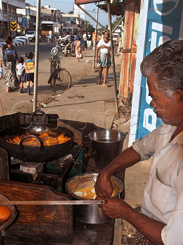 Indian man cooking egg bhaji Deepfried boiled   egg Chennai Madras India