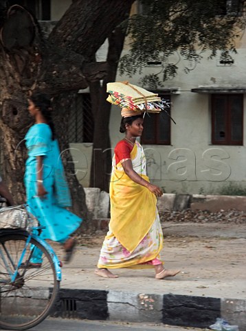 Indian woman carrying goods on head Chennai   Madras India