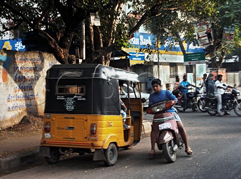 Auto and motorcycles on road Chennai Madras India