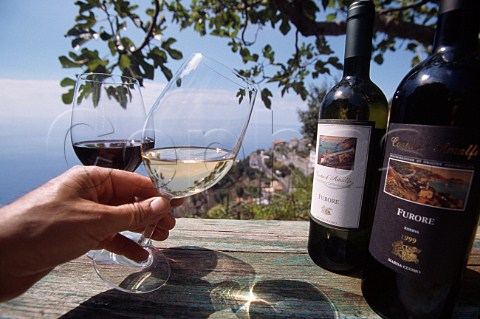 Bottles of red and white Marisa Cuomo  wine on table above the Amalfi coast  Furore Costa dAmalfi Campania Italy
