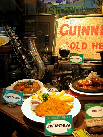 Plastic models of food in a window display outside   an Irish pub
