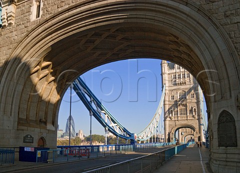 Archway of Tower Bridge with the Swiss Re Tower London Gherkin beyond London