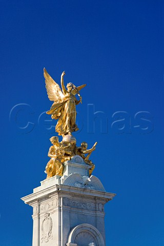 Sculpture of Victory at the pinnacle of the Victoria Monument in front of Buckingham Palace London