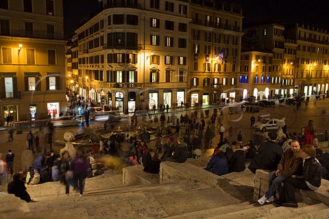 People gathering on the Spanish Steps at night Piazza di Spagna Rome Italy