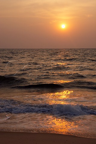 Sunset over the Lakshadweep Sea part of the Arabian Sea at Kattoor Kalavoor Alappuzha Alleppey Kerala India