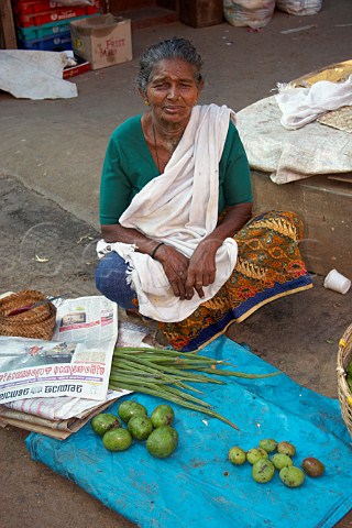 Indian woman selling her fresh produce at Connemara Market Thiruvananthapuram Trivandrum Kerala India