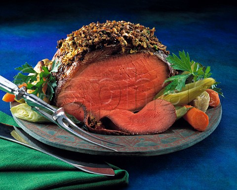 Roast beef with herb crust and vegetables