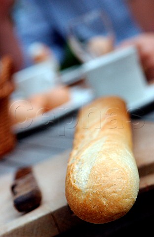 Baguette on bread board