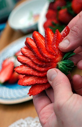 Chef slicing a strawberry
