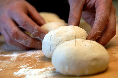 Preparing bread dough to make rolls