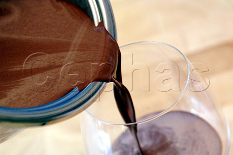 Pouring chocolate mousse into a glass