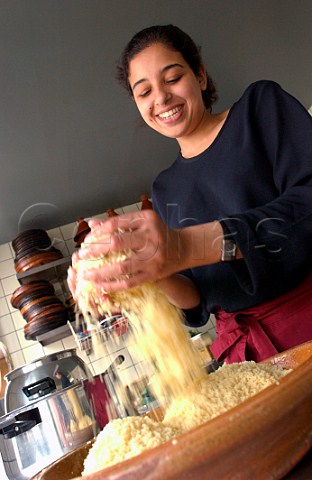 Female chef preparing couscous