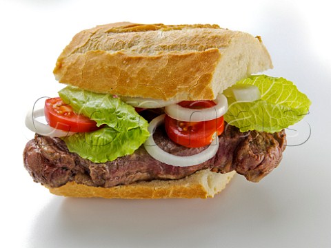Steak and salad in French bread