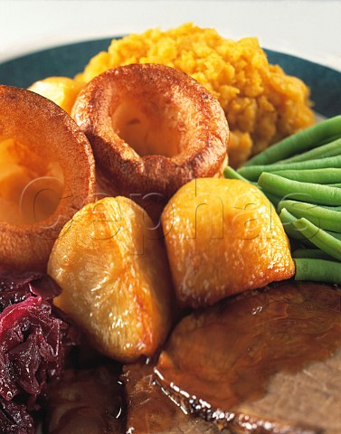 Roast beef Yorkshire pudding roast potatoes with mashed swede and french beans