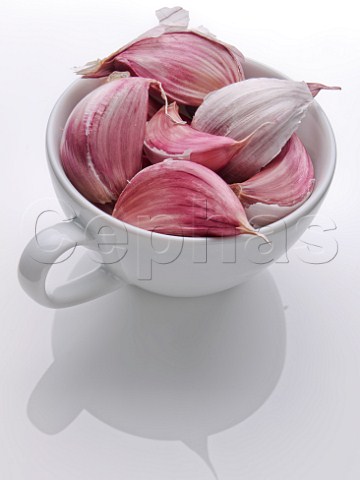 Cup full of garlic cloves