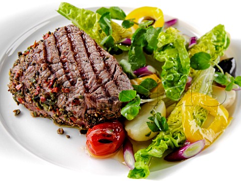 Peppered rump steak with salad