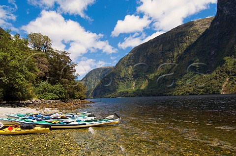 Kayaks beached in Hope Arm in Doubtful Sound Fiordland National Park South Island New Zealand
