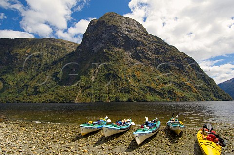 Kayaks beached in Hope Arm in Doubtful Sound Fiordland National Park South Island New Zealand