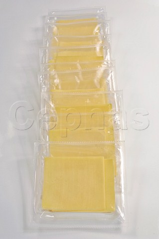 Plastic packs of processed cheese