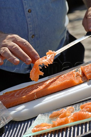 Slicing smoked salmon
