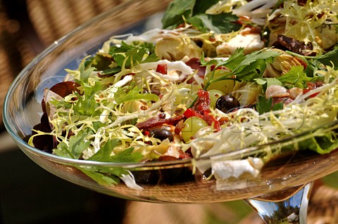 Green and grape salad in glass comport