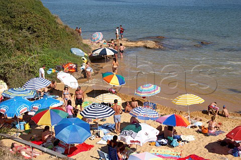 People on the beach by the Mira River estuary at Vila Nova de Milfontes Odemira Portugal