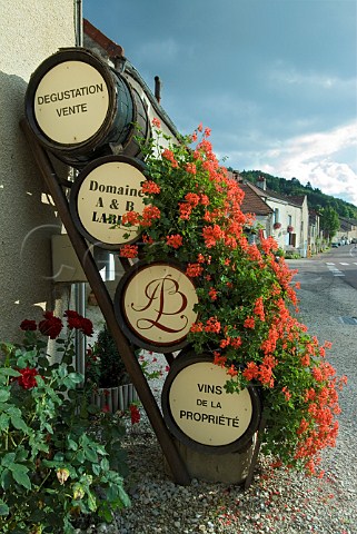 Display of wine barrels and geraniums outside Domaine AB Labry AuxeyDuresses Cte dOr France
