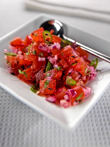 Dish of fresh red pepper and onion salad