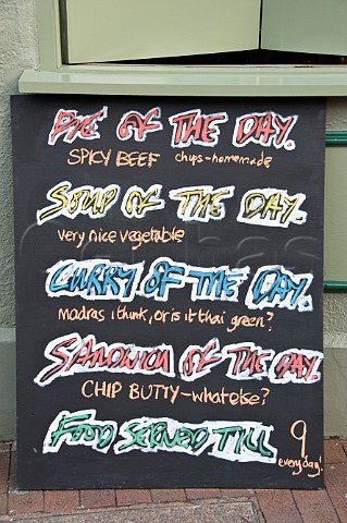 Humorous menu board outside a small wine bar Lewes East Sussex England