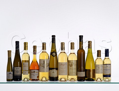 Bottles of sweet wines from different countries regions and grape varieties Germany Mosel Rheingau Hungary Tokaji France Sauternes Barsac Alsace Gaillac Monbazillac Coteaux du Layon South Africa Cape Point Australia Riverina