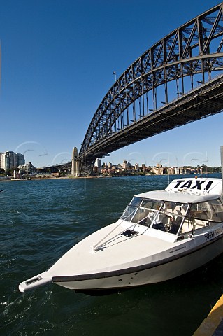 Water Taxi and Sydney Harbour Bridge seen from Walsh Bay Sydney New South Wales Australia