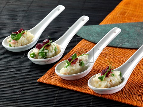 Ham and pea risotto in chinese spoons