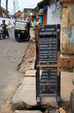 Sign outside shop selling tea spices and pickles Kochi Cochin Kerala India