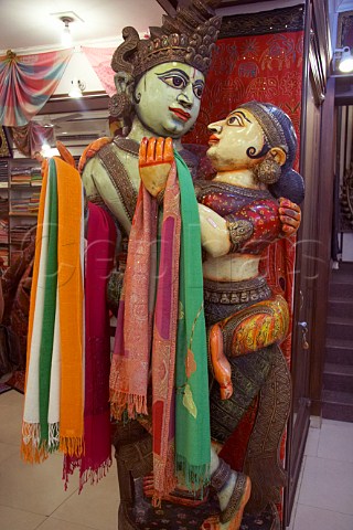 Pashmina shawls for sale on a Indian staue in Euphoria Arts Emporium Government of India recognised shop in Jew Town Mattancherry Kochi Cochin Kerala India