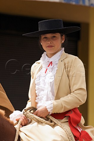 A young Huasa girl on horseback for the 18th September Independence Day celebration Santa Cruz Chile
