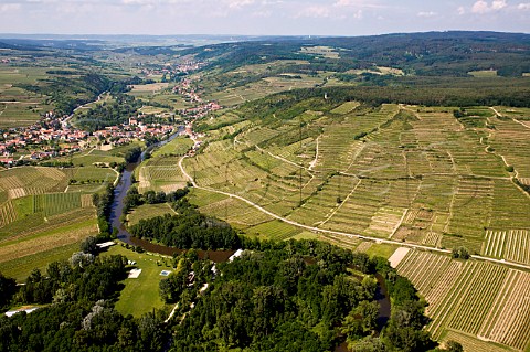 River Lamp and the terraces of Zbinger Heiligenstein vineyard with Zbing village near Langenlois in the distance Austria Kamptal