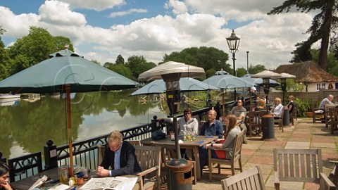 Lunchtime at the Swan public house overlooking the River Thames Pangbourne Berkshire England