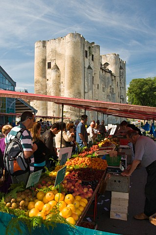 Fresh fruit and vegetable stall in the openair market next to the medieval donjon at Niort DeuxSvres France