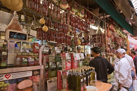 Delicatessen stall at the indoor food and produce market Little Italy The Bronx New York USA