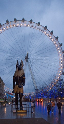 Egyptian statue and London Eye at dusk  London