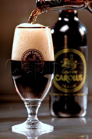 Pouring glass of Gouden Carolus Belgian beer