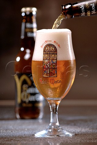 Pouring glass of SaintMartin Belgian beer
