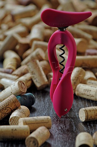 Pink corkscrew and corks