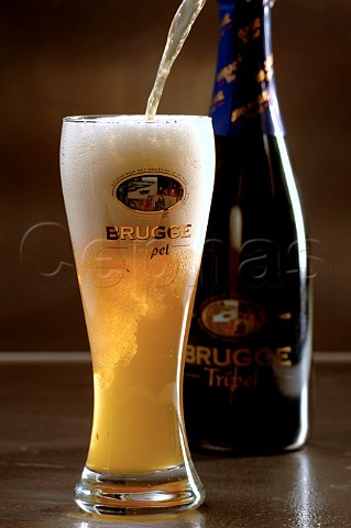 Glass and bottle of Brugge Tripel Belgian beer