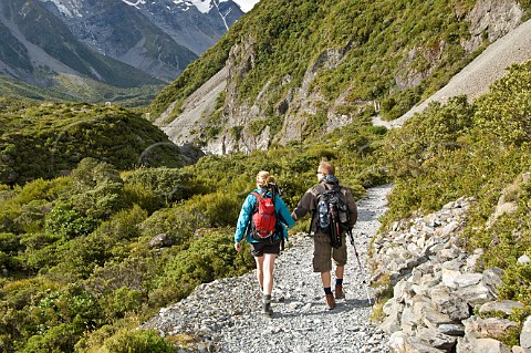 Couple on Hooker Valley trail Mt Cook  Aoraki National Park South Island New Zealand