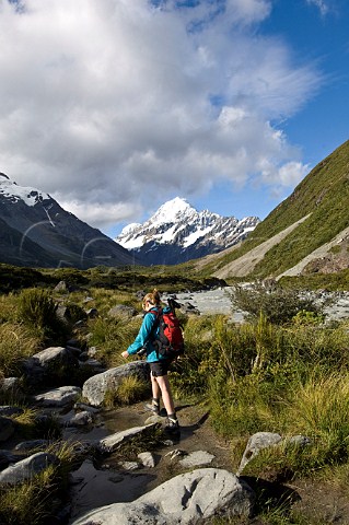 Woman on Hooker Valley trail Mt Cook  Aoraki National Park South Island New Zealand