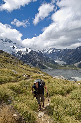 Hiker on trail to Mueller Hut Mt Cook  Aoraki National Park South Island New Zealand